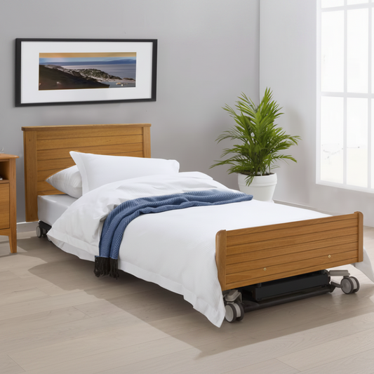 EN7 floorline electric bed with Ironstone frame and Natural Oak laminate head and footboards.